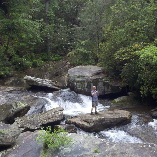 a large waterfall over a rocky area