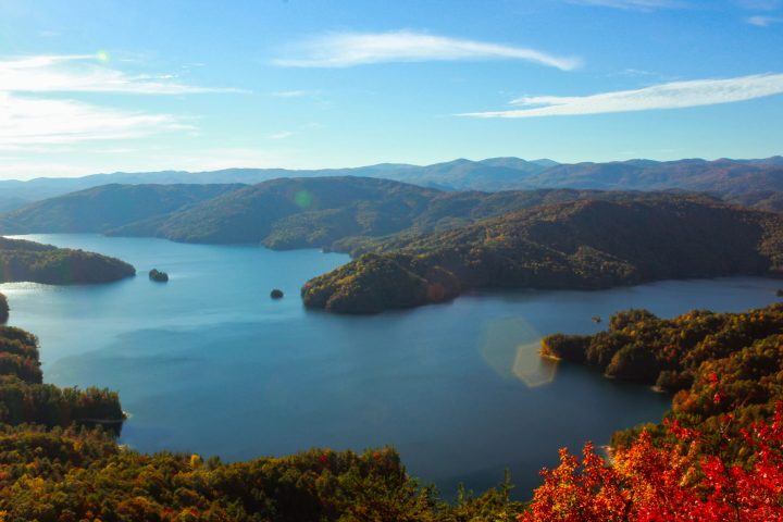 a view of a large body of water with a mountain in the background