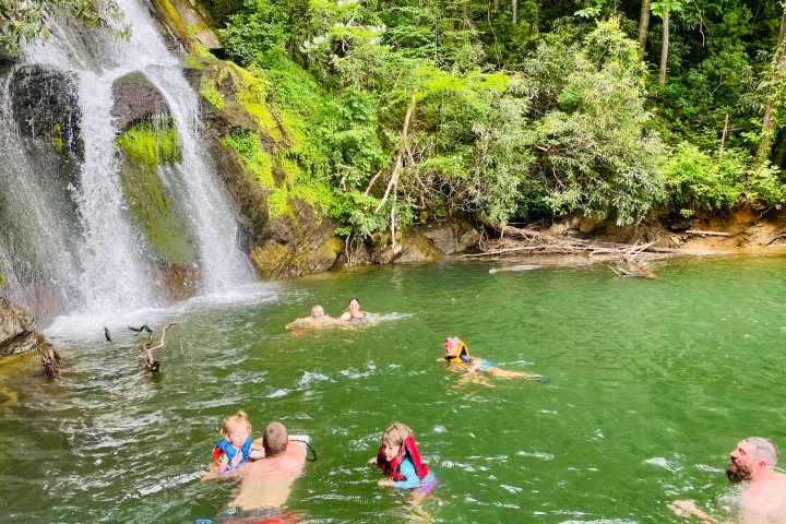 a group of people riding skis on a lake