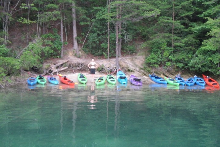 a group of people on a raft in a body of water