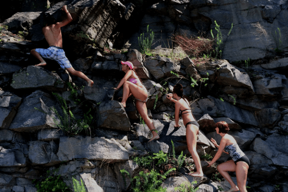 a group of people on a rock