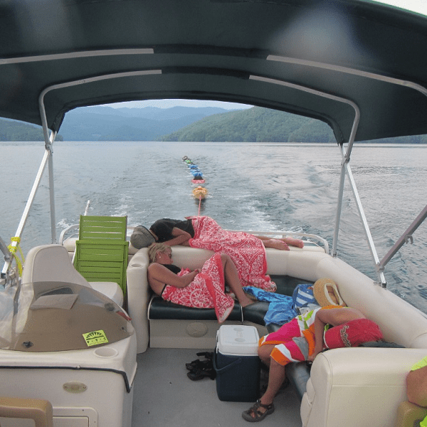 a boat sitting on top of a car