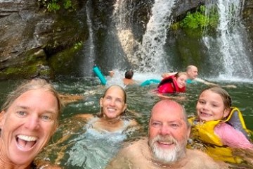a group of people swimming in a body of water