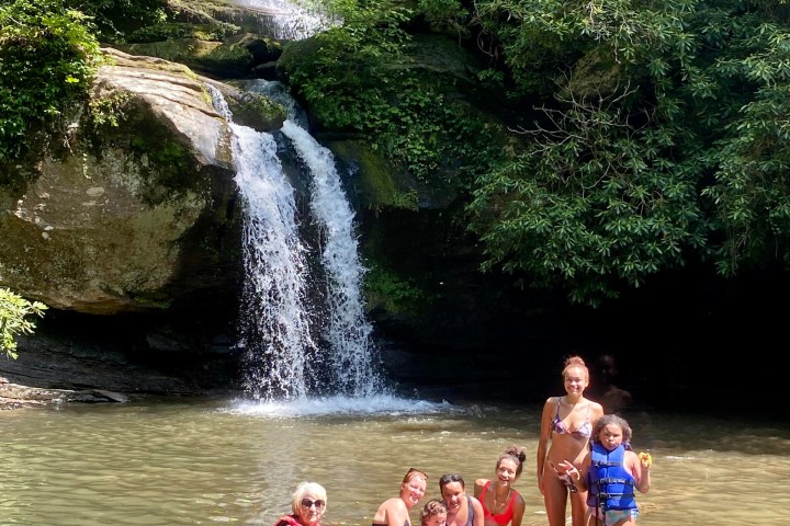 a group of people playing in the water