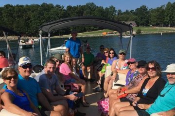 a group of people sitting on a boat