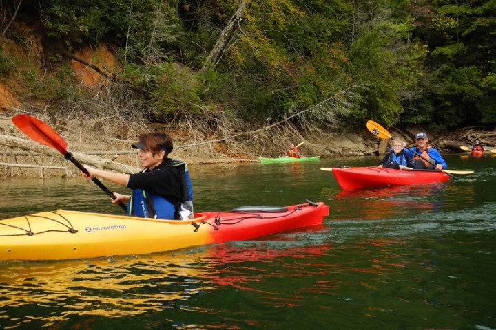 a young child riding on a raft in a body of water