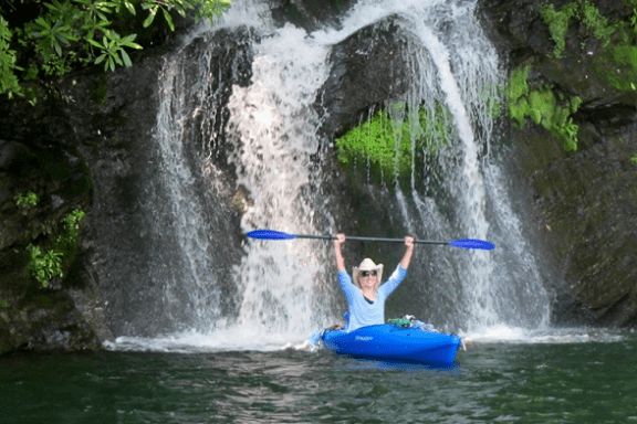 a man riding on the back of a waterfall
