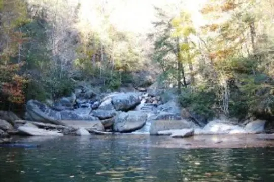 a large waterfall over a body of water