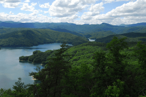 a large body of water with a mountain in the background
