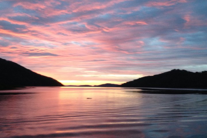 a sunset over a body of water