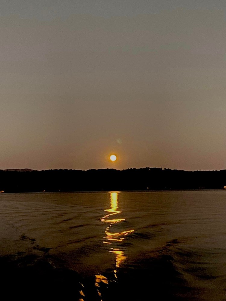 a sunset over a body of water