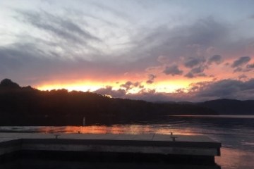 a sunset over a body of water