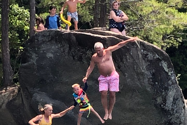 a group of people swimming in the water