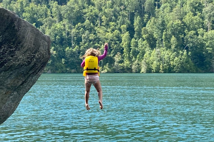 a group of people swimming in a body of water