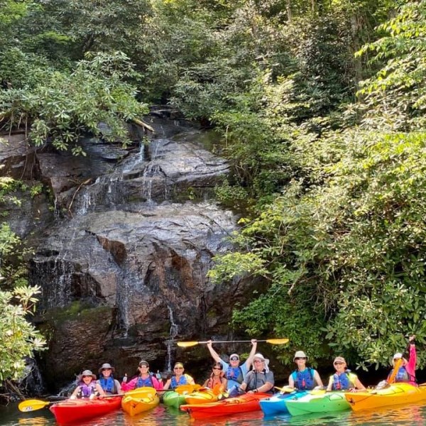 a group of people riding on the back of a boat