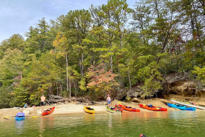 a group of people on a boat in the water