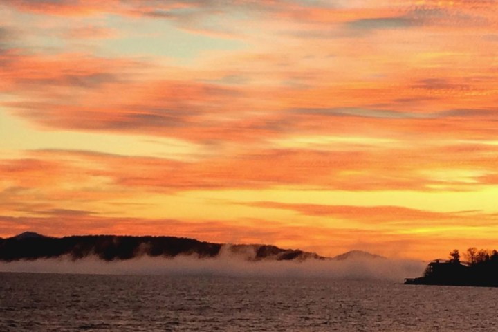 a sunset over a body of water