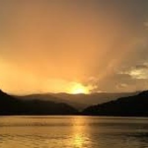 a sunset over a body of water