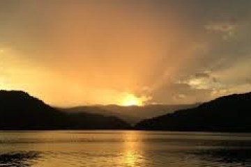 a sunset over a body of water