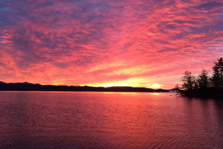 a sunset over a body of water