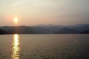 a sunset over a body of water