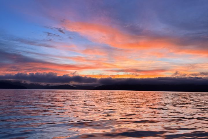 a sunset over a body of water
