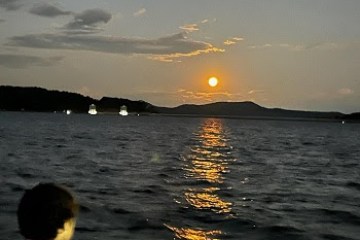 a sunset over a body of water