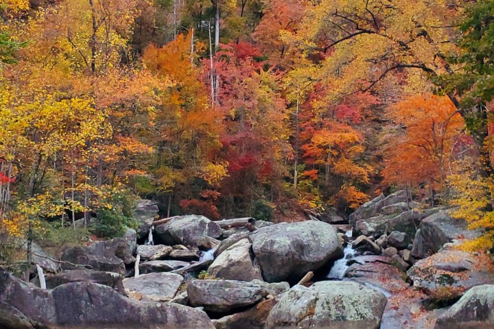 a large waterfall over a body of water