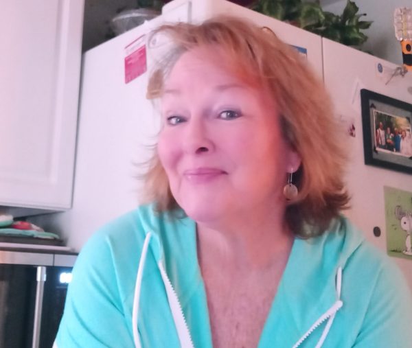 a woman sitting on a kitchen counter