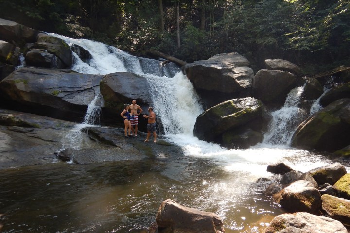 a large waterfall over some water