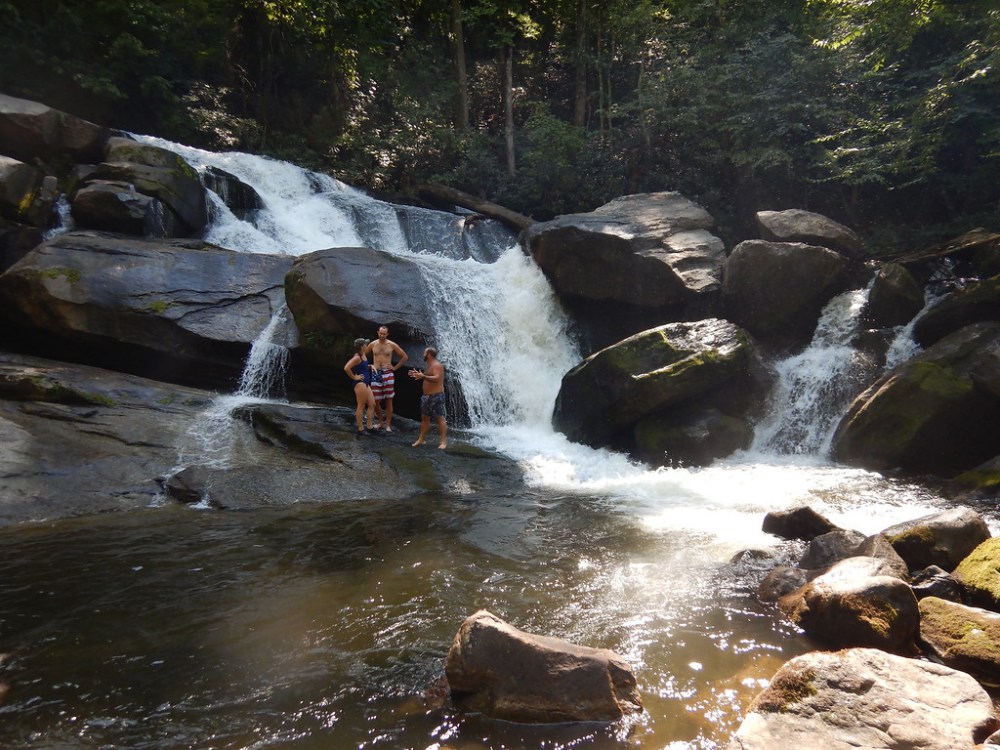 a large waterfall over some water