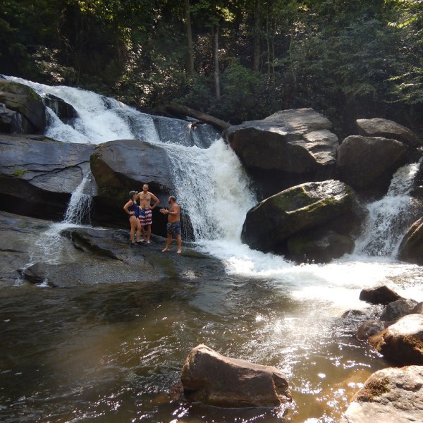 a large waterfall over some water
