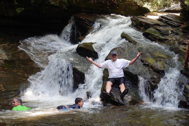 a man riding on the back of a waterfall