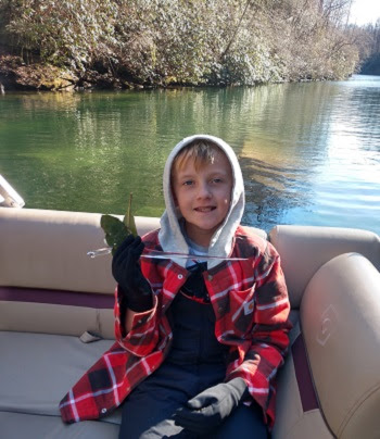 a person sitting on a boat in the water