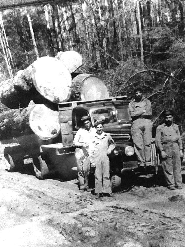 a group of people riding on the back of a truck