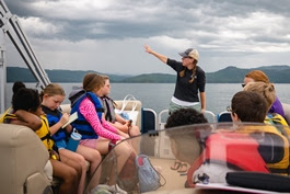a group of people sitting on a boat