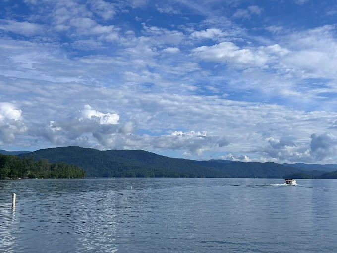 a small boat in a large body of water